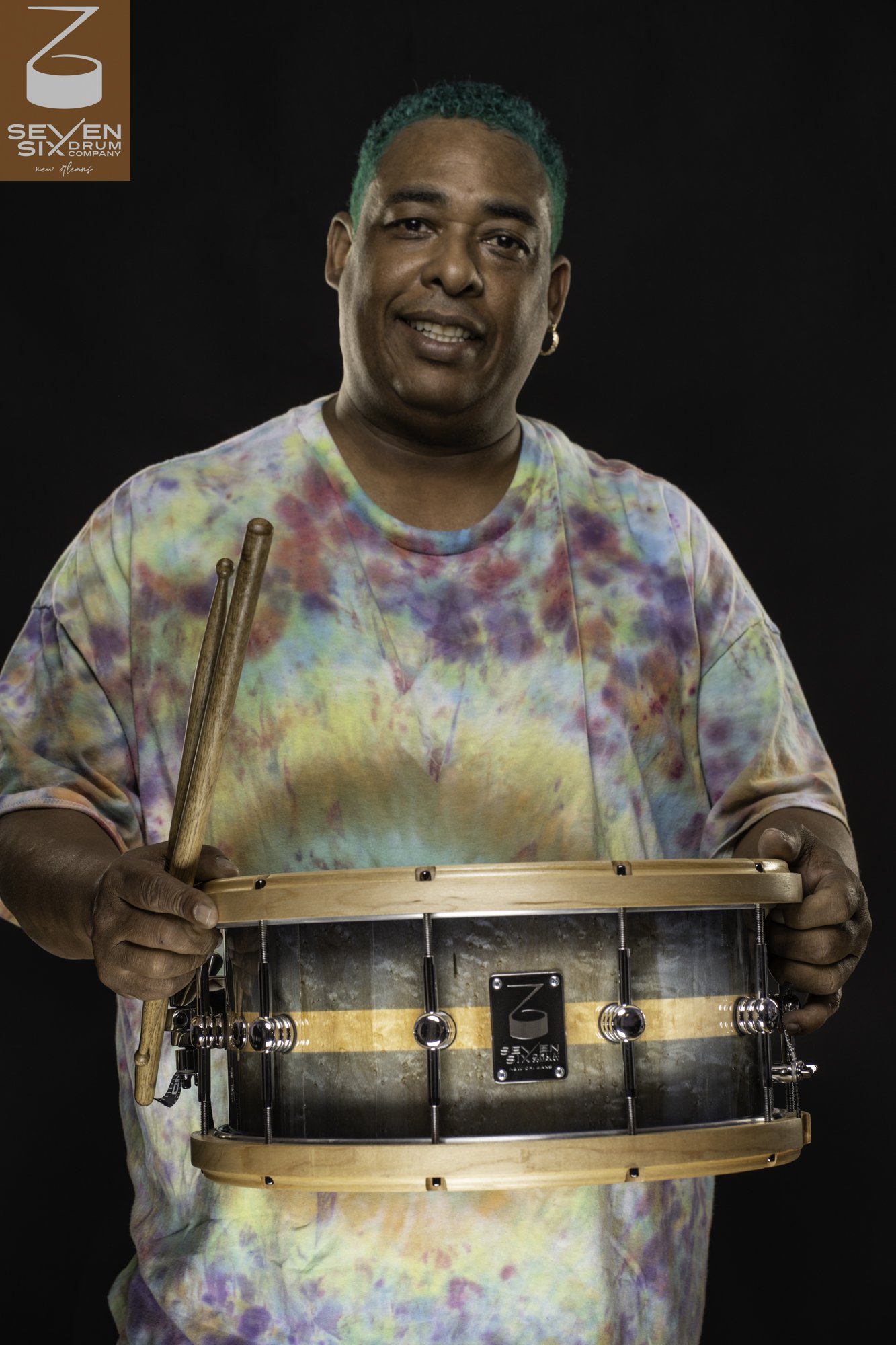 Legendary New Orleans drummer Russell Batiste Jr. seated behind his custom Seven Six Drum Company snare drum