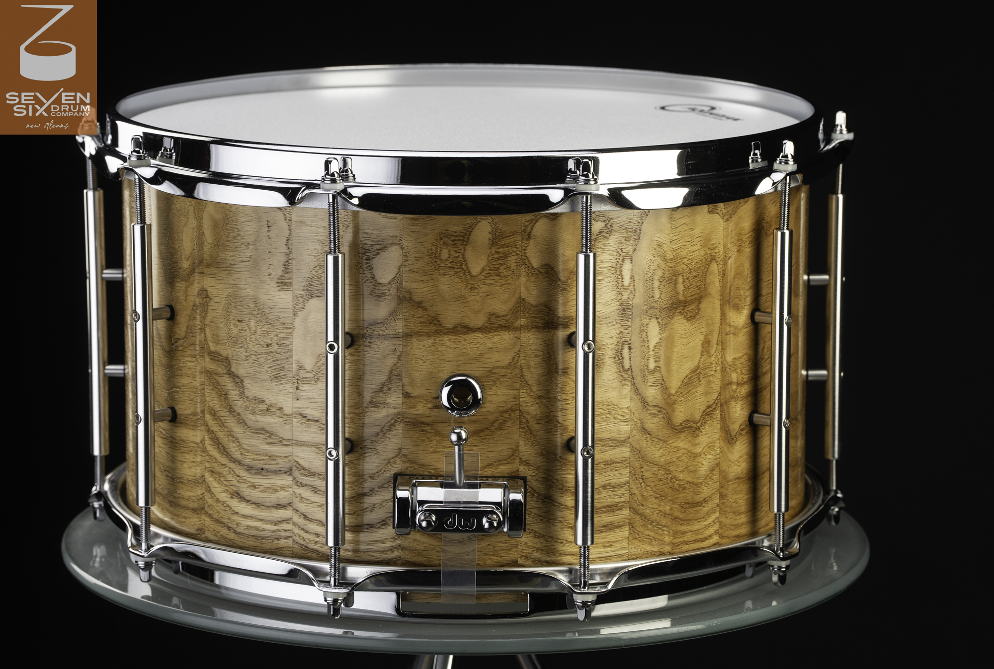 Handmade natural stave wood snare drum with a clear gloss finish, chrome tube lugs, and a DW throw-off.