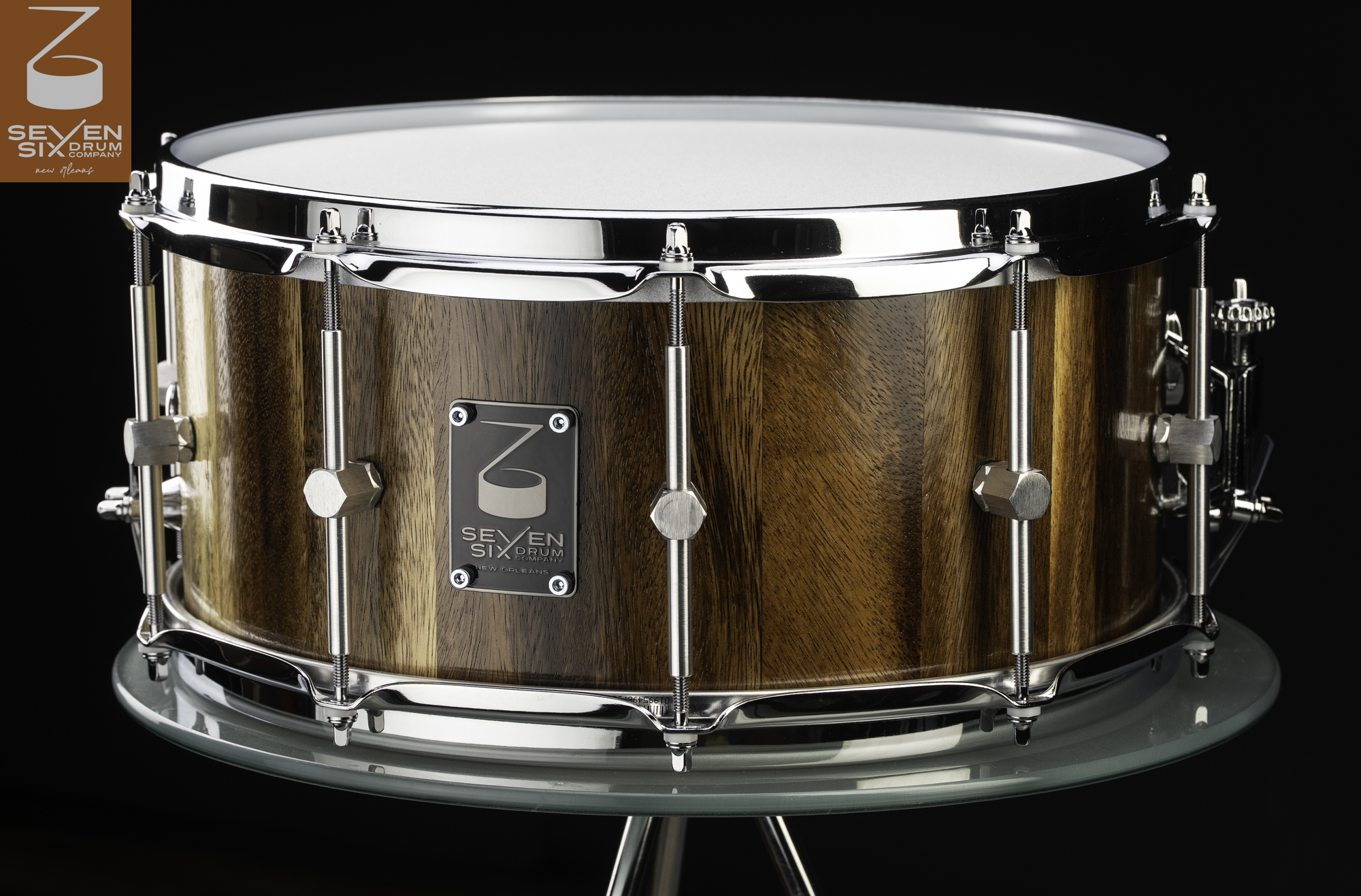 Handmade stave wood snare drum in a natural finish, featuring chrome hoops and single-point hex tube lugs.