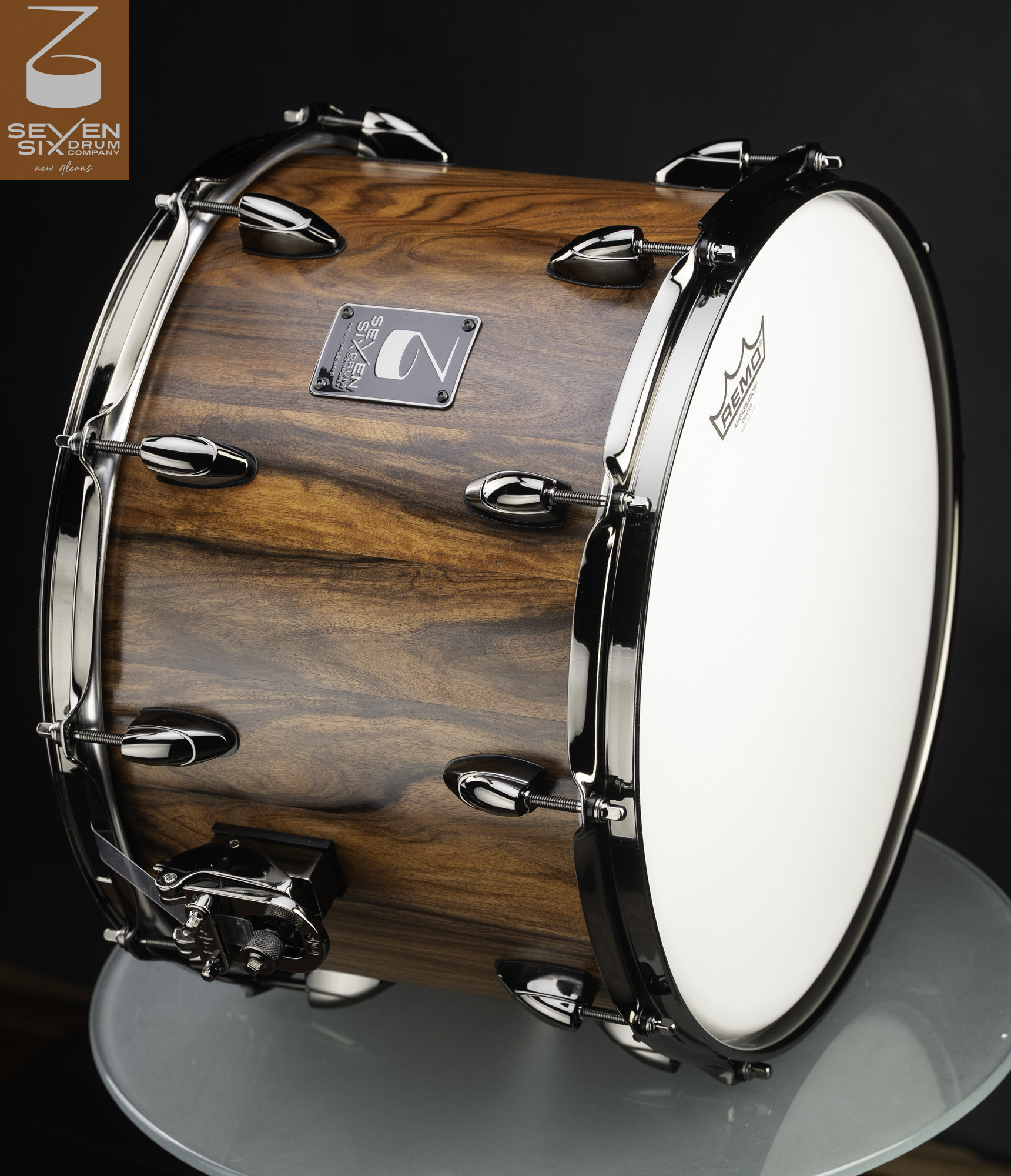 Deep snare drum featuring a rich natural wood grain finish with polished chrome lugs, hoops, and a throw-off.
